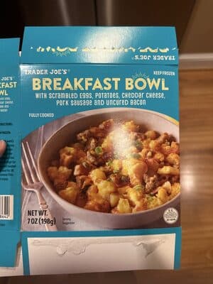 Breakfast Bowl with scrambled eggs, potatoes, cheddar cheese, pork sausage and uncured bacon