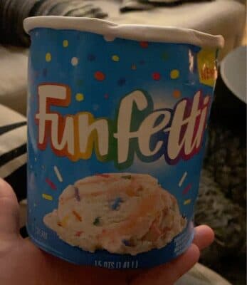 Light Ice Cream With Rainbow Sprinkles And A Cake Crunch Swirl