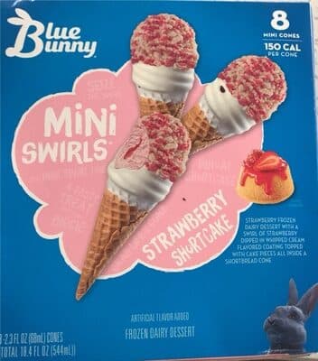 Strawberry Shortcake Frozen Dairy Dessert With A Swirl Of Strawberry Dipped In Whipped Cream Flavored Coating Topped With Cake Pieces All Inside A Shortbread Mini Cone