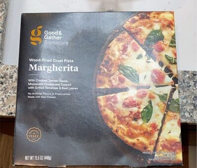 Margherita With Crushed Tomato Sauce, Mozzarella Cheese And Topped With Grilled Tomatoes & Basil Leaves Wood-Fired Crust Pizza