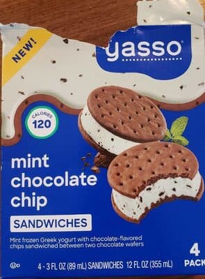 Mint Chocolate Chip Frozen Greek Yogurt With Chocolate-Flavored Chips Sandwiched Between Two Chocolate Wafers
