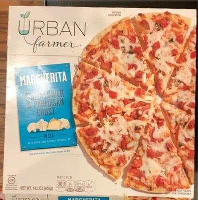 Margherita Topped with Mozzarella and White Cheddar Cheese Blend, with Tomatoes and Basil over Herbed Tomato Sauce Thin Cauliflower Parmesan Crust Pizza