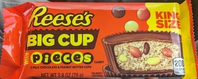 Big cup milk chocolate cups stuffed with pieces candy