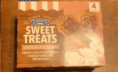 Chocolate Ice Cream Filled Sugar Cone Dipped In Chocolate Flavored Coating Topped With Peanuts Sweet Treats Cones
