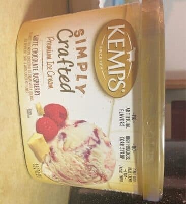 White Chocolate Raspberry Decadent Mascarpone Cheesecake Premium Ice Cream With A Luscious Red Raspberry Swirl & White Chocolaty Flakes