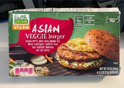 Vegan Patty Made With Brown Rice, Water Chestnuts, Carrots, Peas, Red Peppers, Broccoli, And Soy Sauce Asian Veggie Burger
