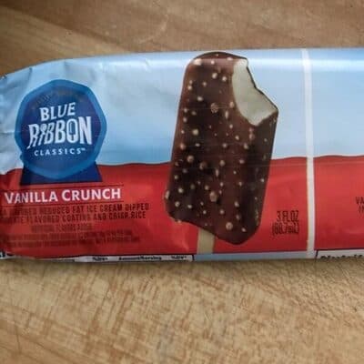 Vanilla Crunch Frozen Dairy Dessert Dipped In Chocolate Flavored Coating And Crisp Rice