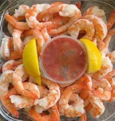 Shrimp cocktail with cocktail sauce lemons