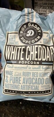 POP DADDY POPCORN, RUBY RED POPCORN, REAL WHITE CHEDDAR CHEESE