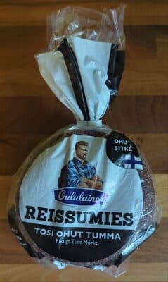 Reissumies tosi ohut tumma